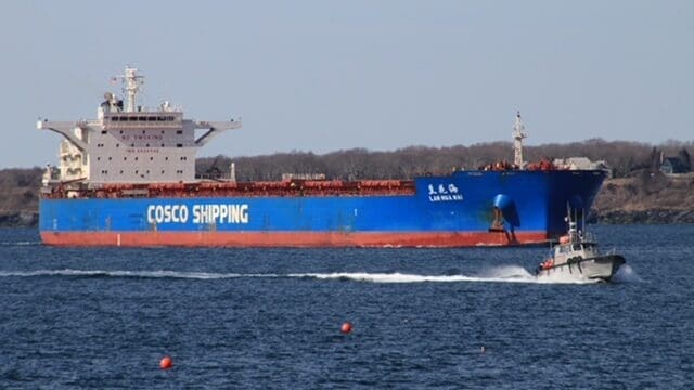 Operations & Resources Large blue cargo ship sailing