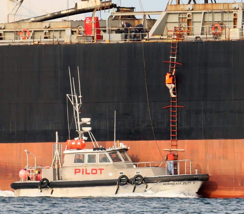 Pilot Stations & Boarding Pilot boat and climbing sailor